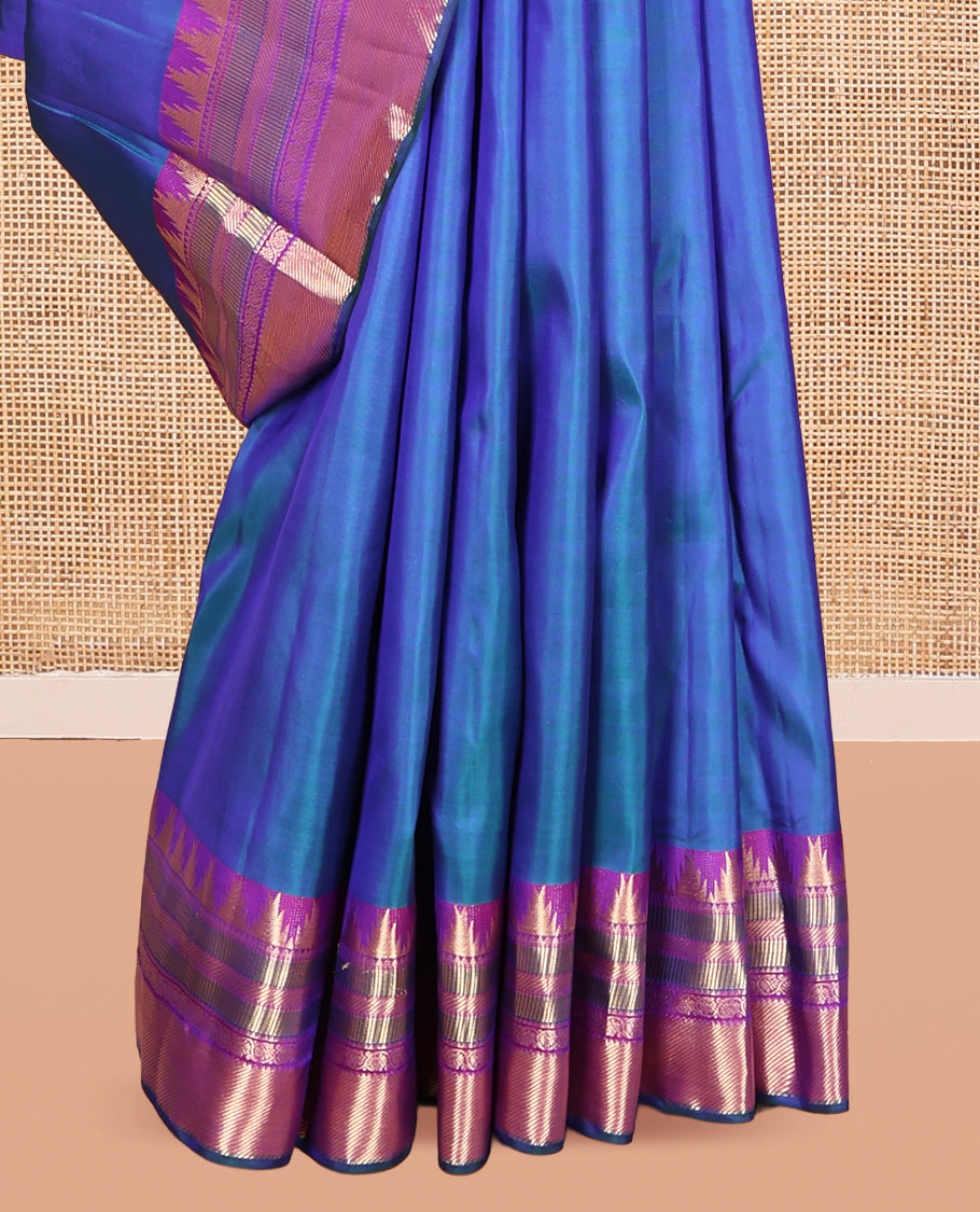 Blue Plain Kanchipuram Silk Saree, Complemented by a Contrast Border of Thazampoo Rekku, Banaras, Muthu, and Kodi Visiry Designs, Mayil Kann Pallu, and a Contrast Blouse
