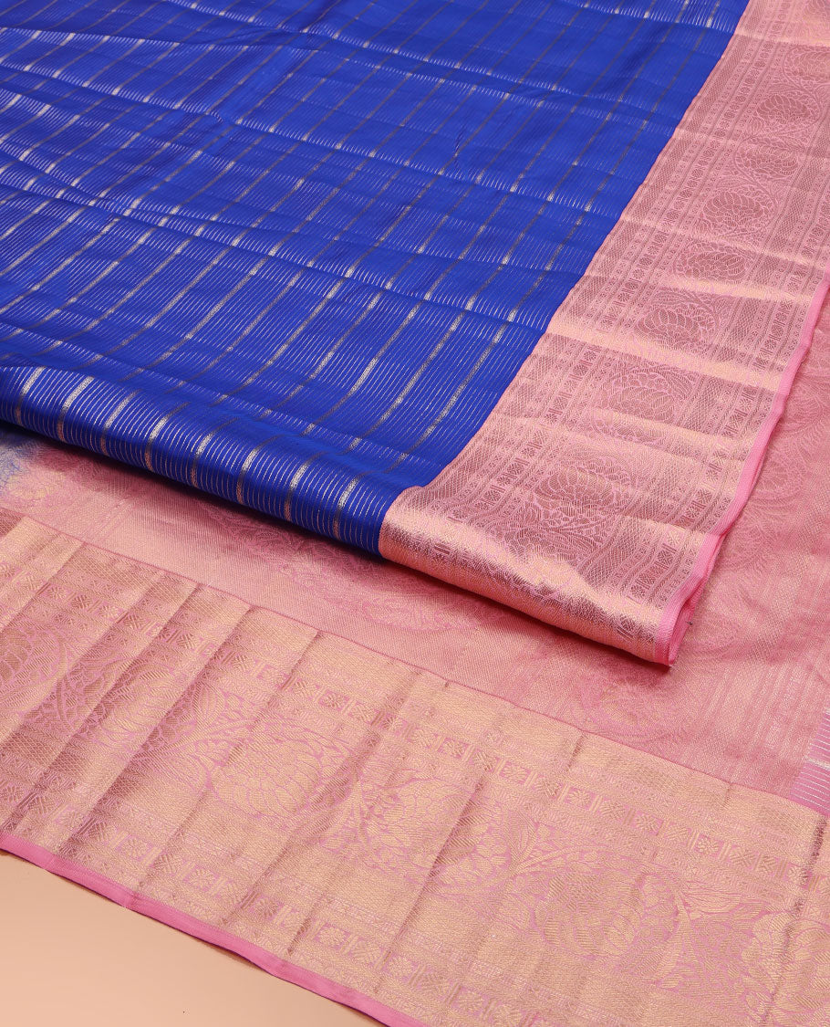 Blue Vasundhara Silk Saree, Beautifully Embellished with Zari Stripes All Over Its Body, Complemented by Contrast Border of Mayil Kann, Rudraksham, and Kodi Visiry Designs, Intricately Designed Pallu, and Paired with a Contrast Blouse