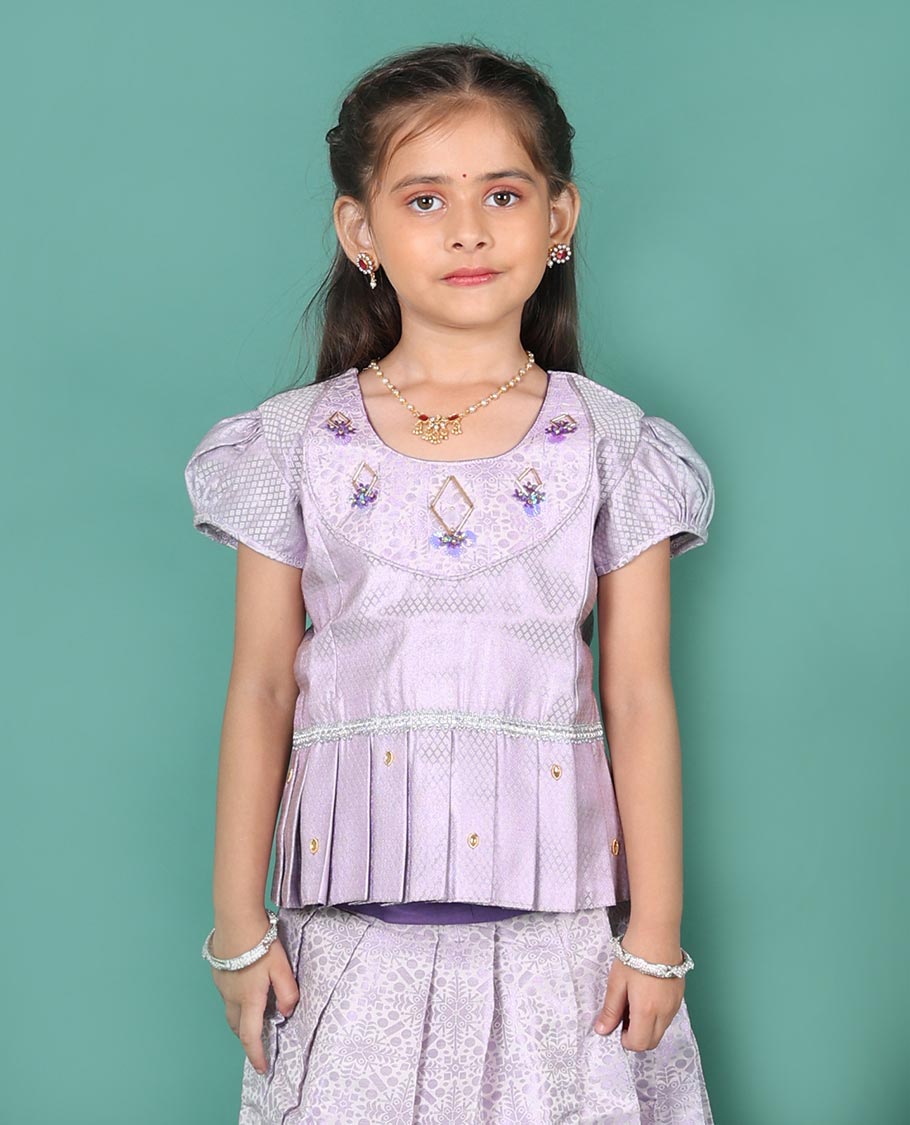 Lavender art silk readymade pavadai set, jacquard with traditional zari border skirt, and jacquard embroidered puff-sleeve blouse