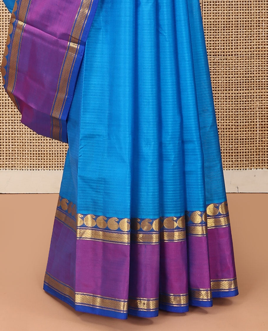 Blue striped Kanchipuram silk saree, contrast rettai pettu border of manga, and mayil kann designs, and zari design pallu