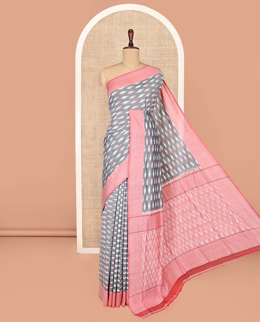Grey Ikkat Cotton Saree, Adorned with Ikkat-Style Buttas on Its Body, Complemented by Contrast Border, Pallu of Chevron Stripes, and Has No Blouse