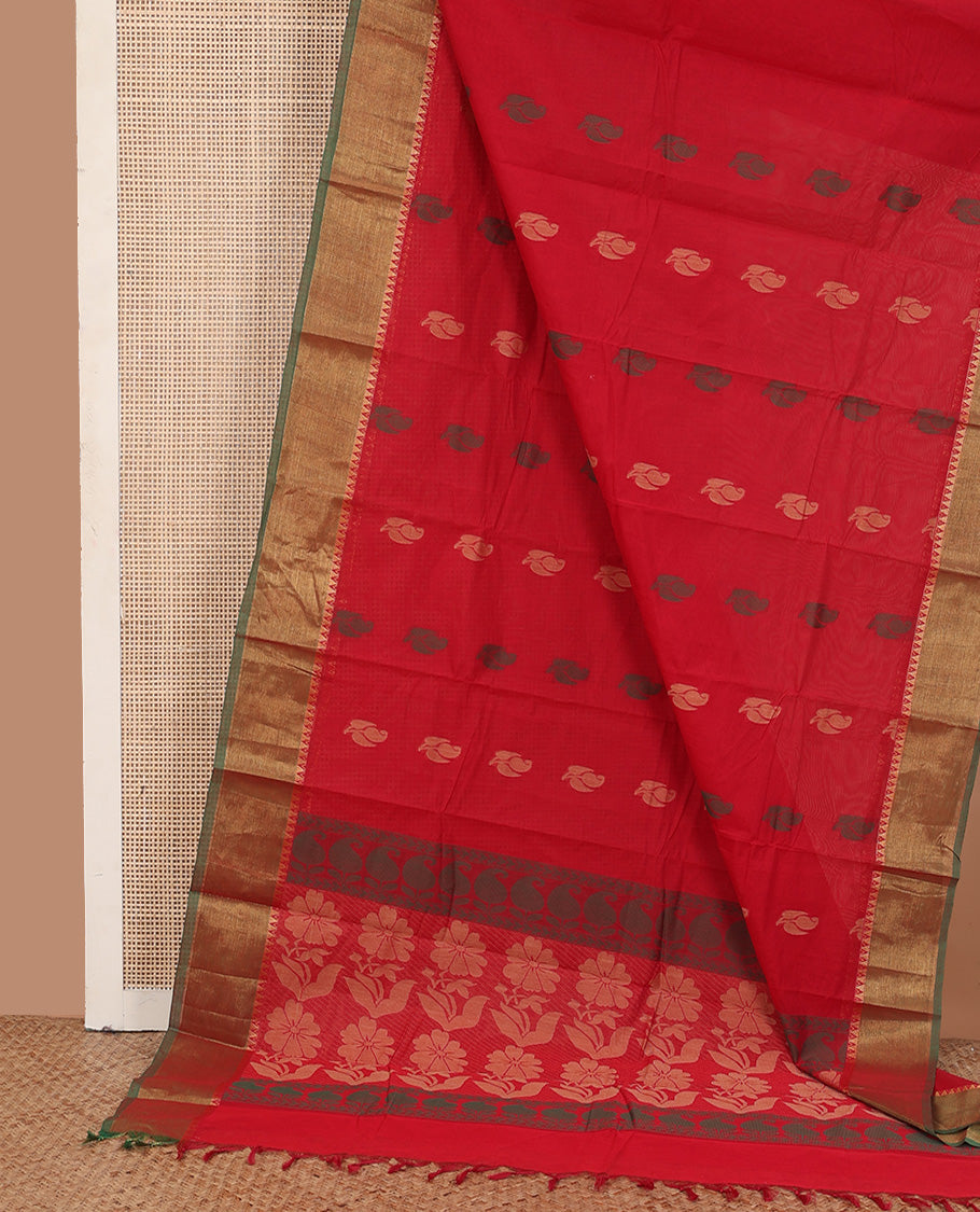 Red buttas kanchi cotton saree, contrast temple zari border, and floral design pallu