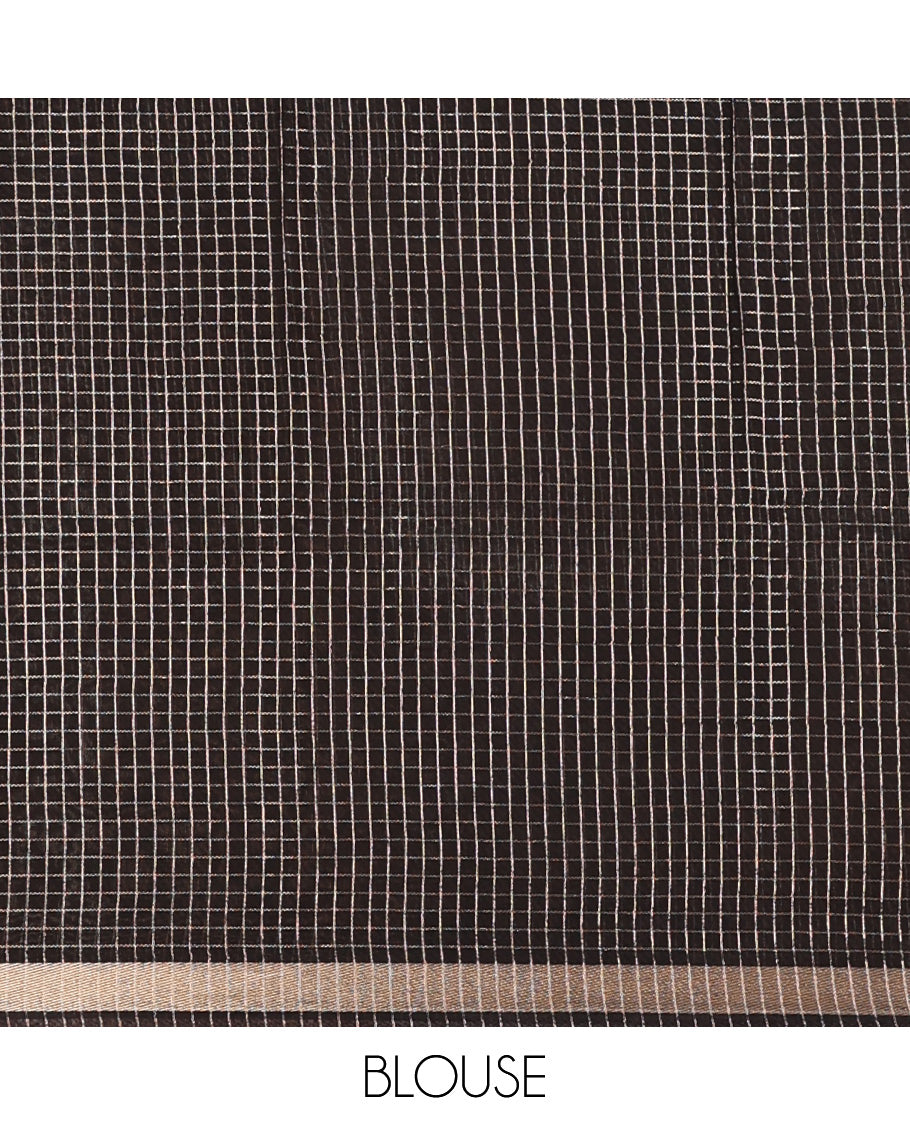 Black and beige half-and-half style Muga silk saree adorned with zari micro-checks, and kalamkari flora-fauna prints, zari piping border, and zari striped pallu