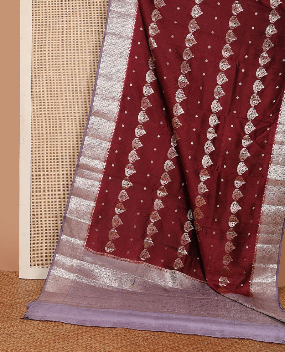 Maroon floral meena buttas raw mango silk saree, contrast floral ogee patterned border, and floral design pallu