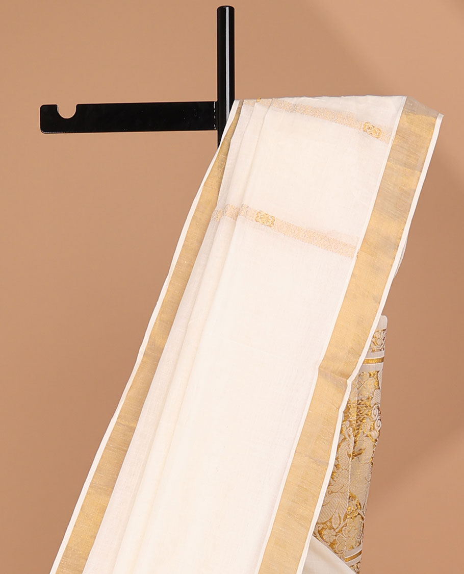 Cream kerala saree with zari stripes, zari border & pallu of peacock designs in zari