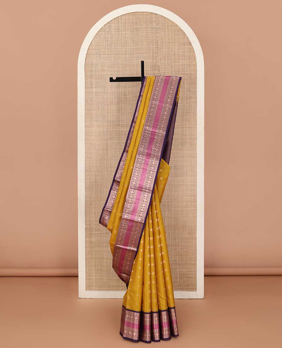 Yellow zari buttas silk saree, contrast border of thilakam,kathir, rudraksham, and mayil kann, and jaal pallu