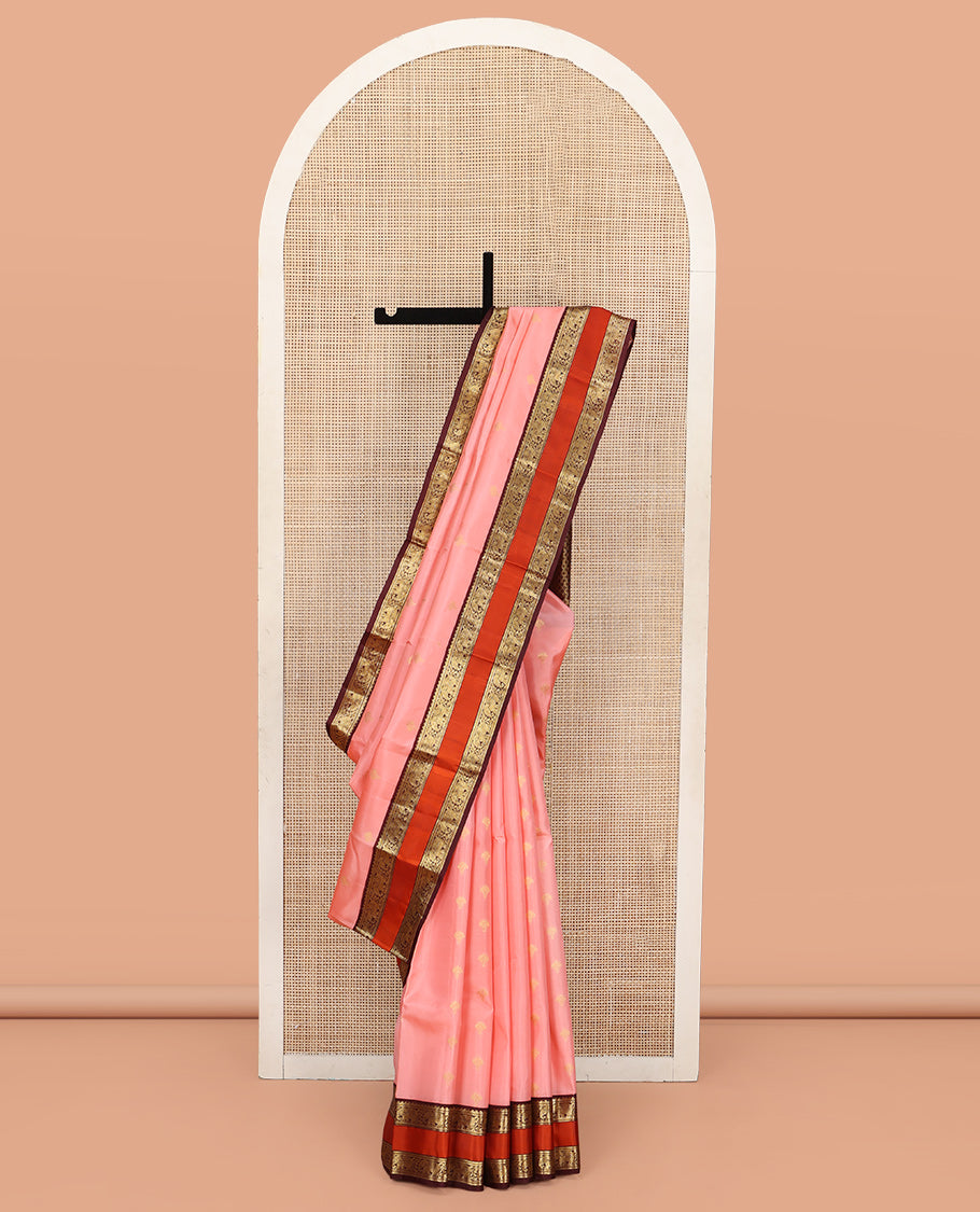 Pink Vasundhara Silk Saree, Sparsely Sparkled with Zari Buttas All Over Its Body, Complemented by a Contrast Rettai Pettu Border of Rekku, Muthu, and Yaanai Designs, Grand Geometric Pallu, and Paired with a Contrast Blouse