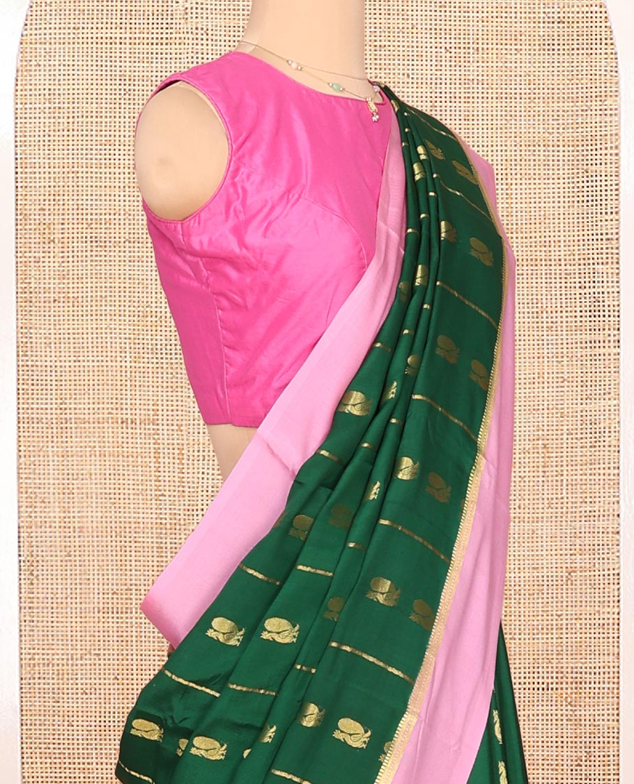 Green Mysore Silk Saree, Adorned With Zari Stripes and Peacock Buttas Across Its Body, Complemented by Captivating Contrast Border of Traditional Zari Designs, Pallu Steeped with Traditional Zari Designs, and Paired with a Contrast Blouse