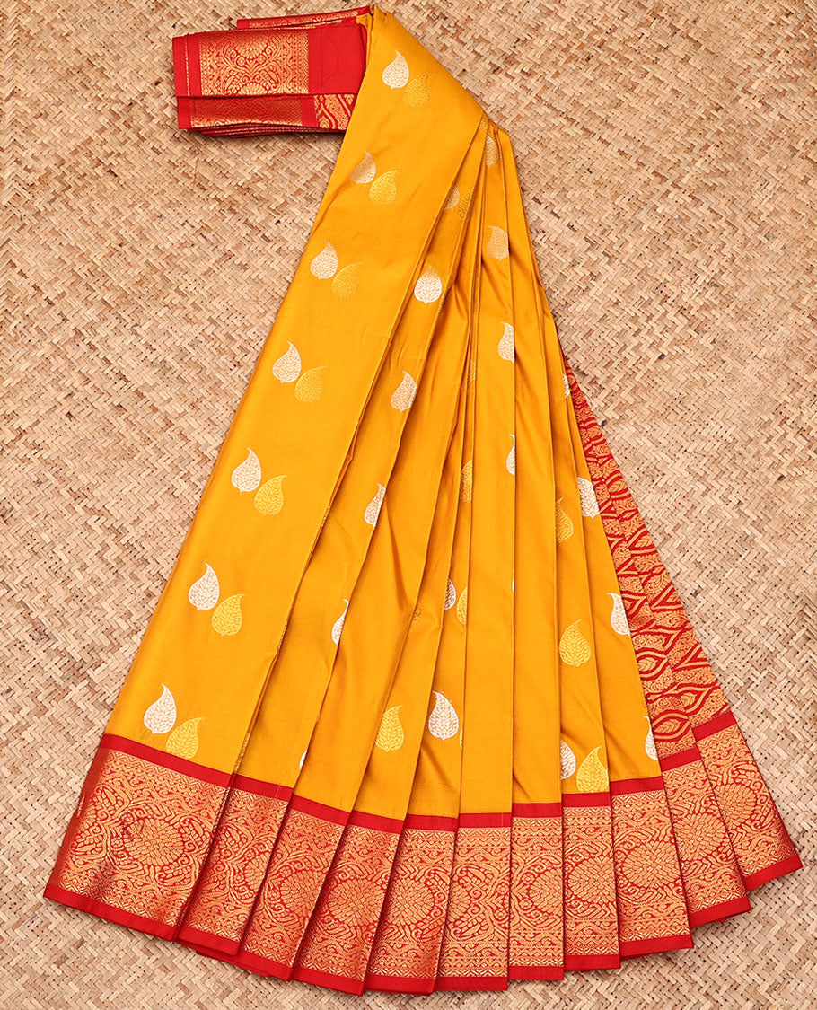 Yellow Budget Silk Saree, Ornamented with Leaf Buttas All Over Its Body, Complemented by a Contrast Traditional Zari Border, Grand Ogee Patterned Pallu, and Paired with a Contrast Blouse