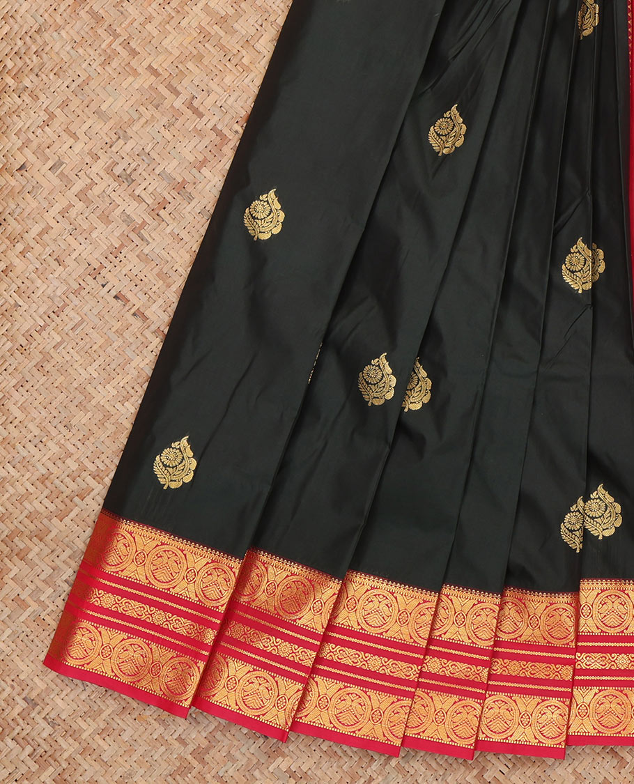 Black Budget Silk Saree, Showcasing Zari Buttas, Complemented by Contrast Traditional Zari Border, a Grand Pallu and a Contrast Blouse