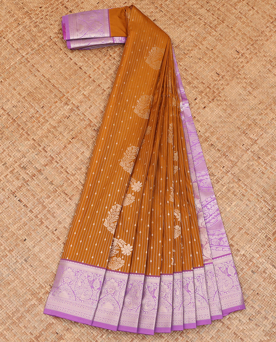 Orange Budget Silk Saree Artfully Detailed with Zari Stripes and Floral Buttas All Over Its Body, Complemented by a Contrast Traditional Zari Design Border, Pallu Opulently Embellished with Intricate Design, and Paired with a Contrast Blouse