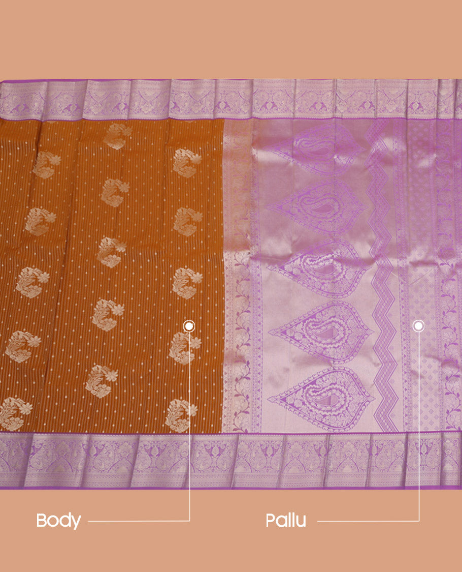 Orange Budget Silk Saree Artfully Detailed with Zari Stripes and Floral Buttas All Over Its Body, Complemented by a Contrast Traditional Zari Design Border, Pallu Opulently Embellished with Intricate Design, and Paired with a Contrast Blouse