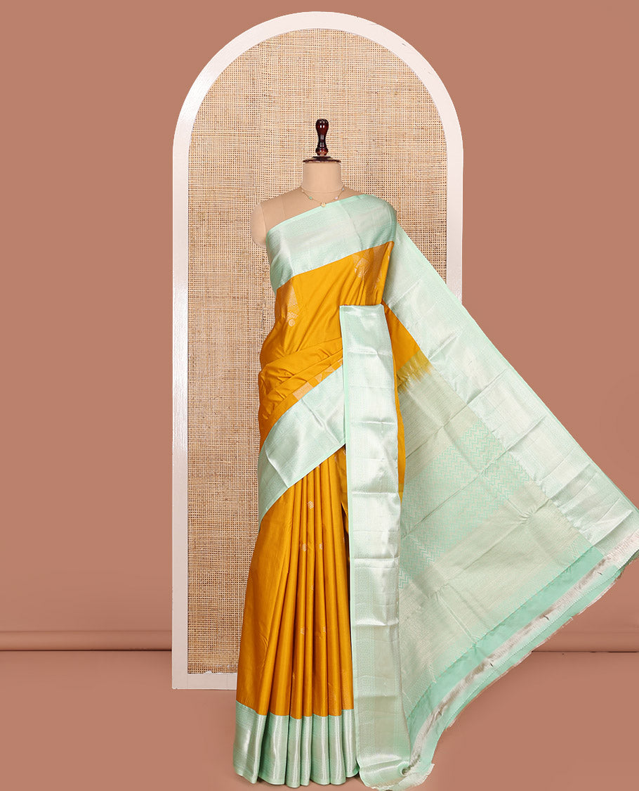 Mustrad Budget Silk Saree, Embellished with Zari Buttas All Over Its Body, Complemented by Contrast Border of Traditional Designs Woven in Zari, Majestically Detailed Pallu, and Paired with a Contrast Blouse