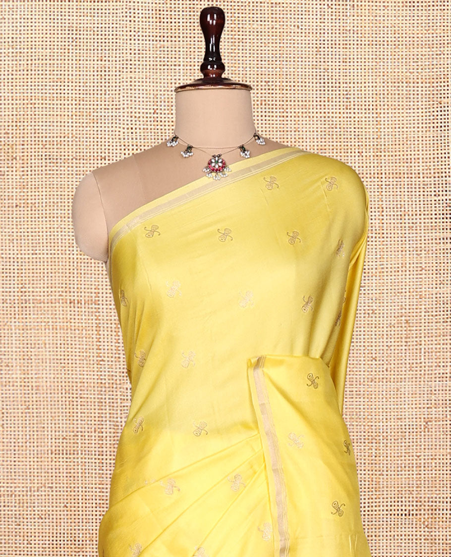 Light Yellow Satin Silk Saree, Subtly Sparkled with Zari Buttas, a Subtle Piping Border, Complemented by a Contrast Intricately Designed Pallu, and a Contrast Blouse