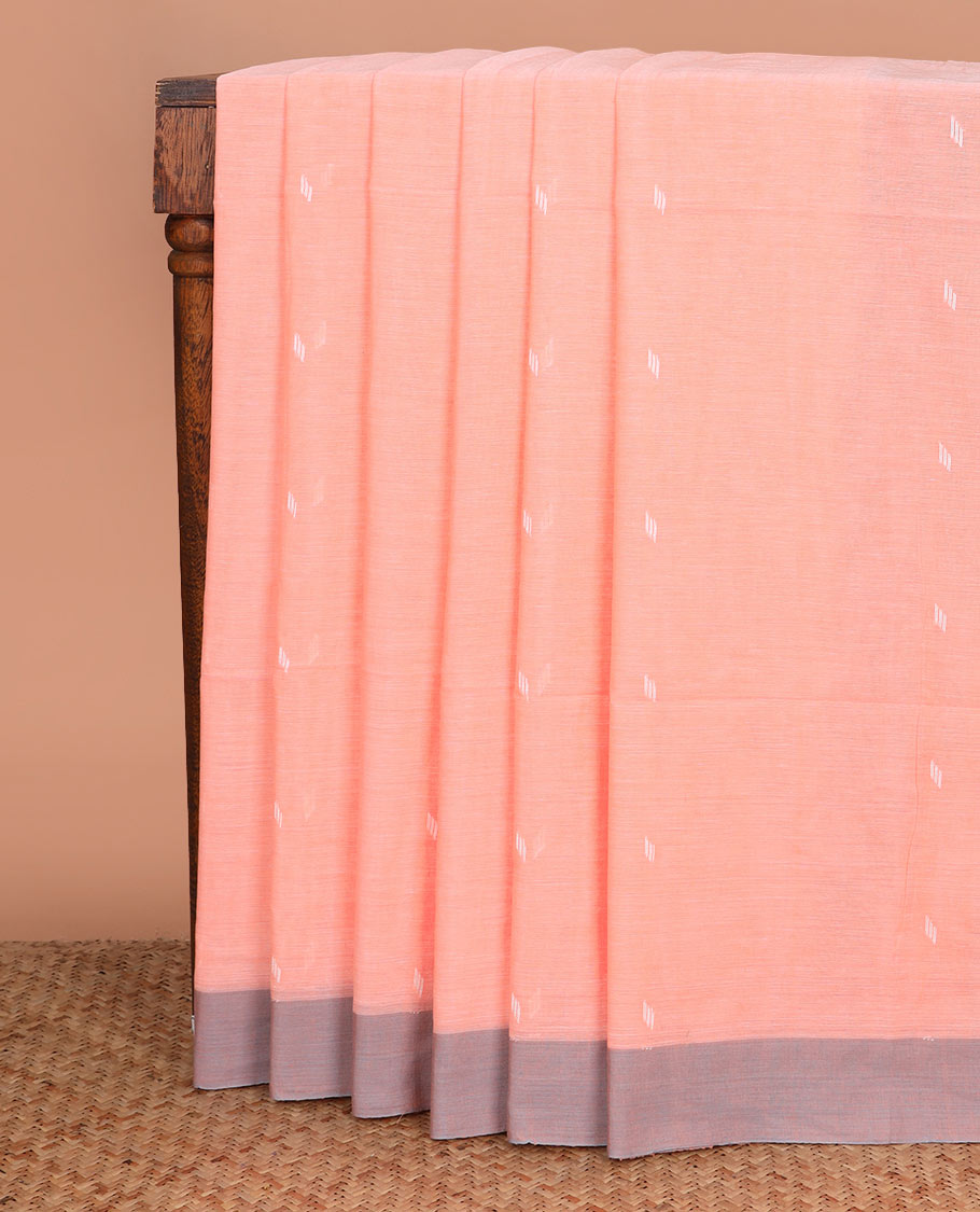 Pastel orange thread buttas Khadi cotton saree, contrast plain border, and pallu of geometric buttas