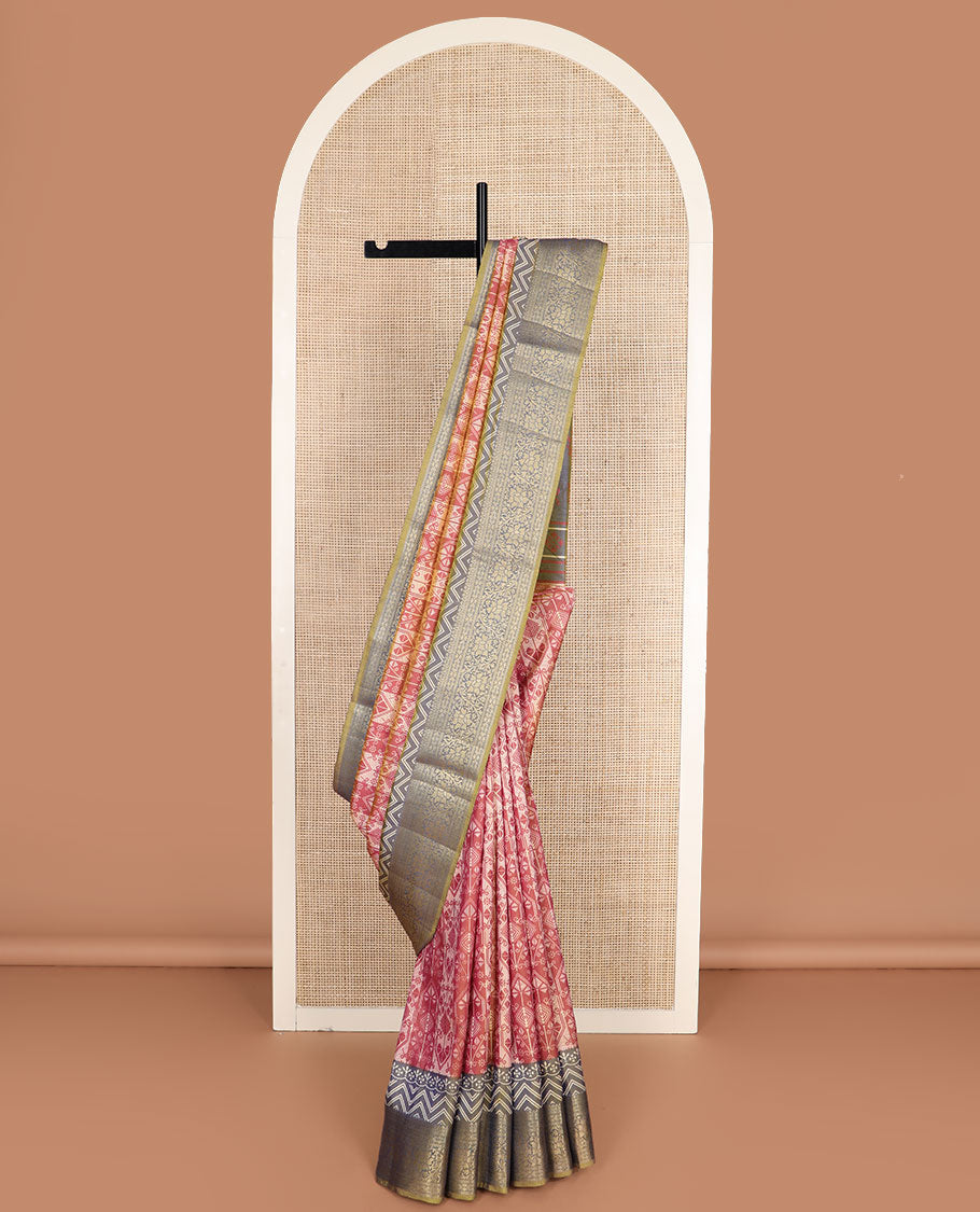 Dark peach intricately designed semi-banaras patola silk saree, contrast floral creeper zari design border, and pallu of chevron and floral designs