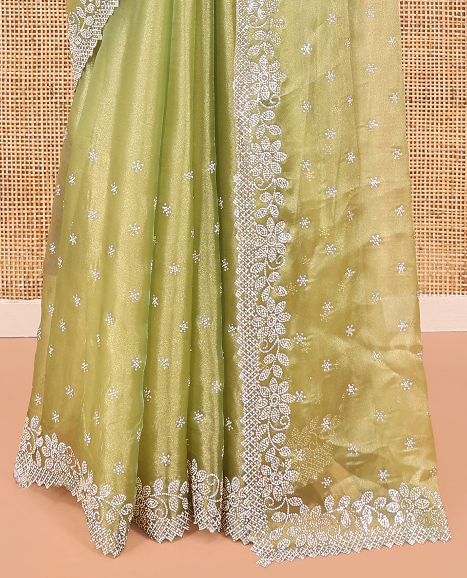 Green Designer Saree, Gleamed up with Stone Work All Over Its Body, Highlighted by Stone Embroidered Border, And Paired with a Matching Blouse