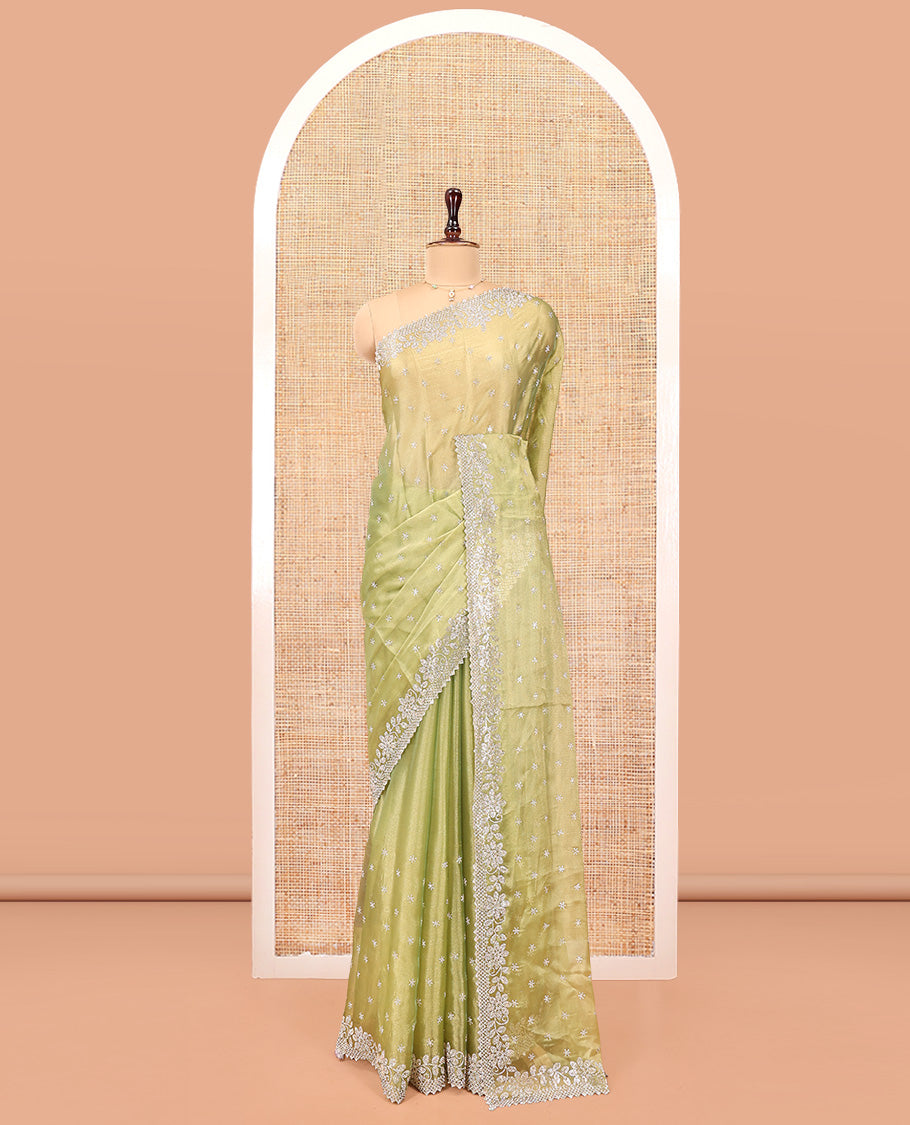 Green Designer Saree, Gleamed up with Stone Work All Over Its Body, Highlighted by Stone Embroidered Border, And Paired with a Matching Blouse