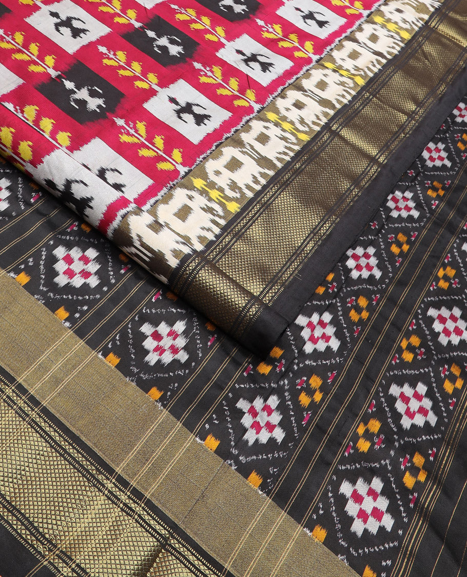 Multi-Colour Ikkat Silk Saree Features Warli Human Buttas and Flower Buttas, a Contrast Border Steeped with Traditional Zari Designs, a Pallu of Diamond Patterns, and a Contrast Blouse