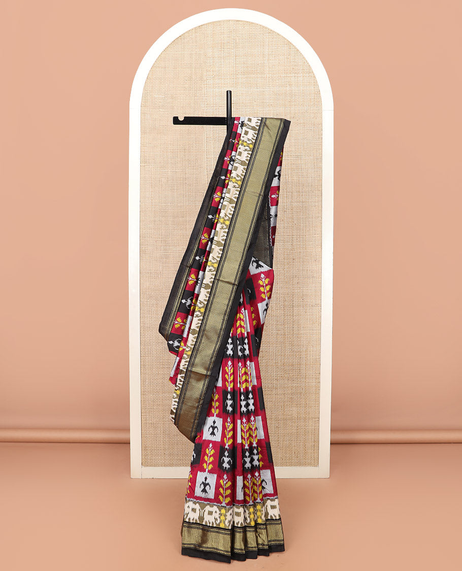 Multi-Colour Ikkat Silk Saree Features Warli Human Buttas and Flower Buttas, a Contrast Border Steeped with Traditional Zari Designs, a Pallu of Diamond Patterns, and a Contrast Blouse