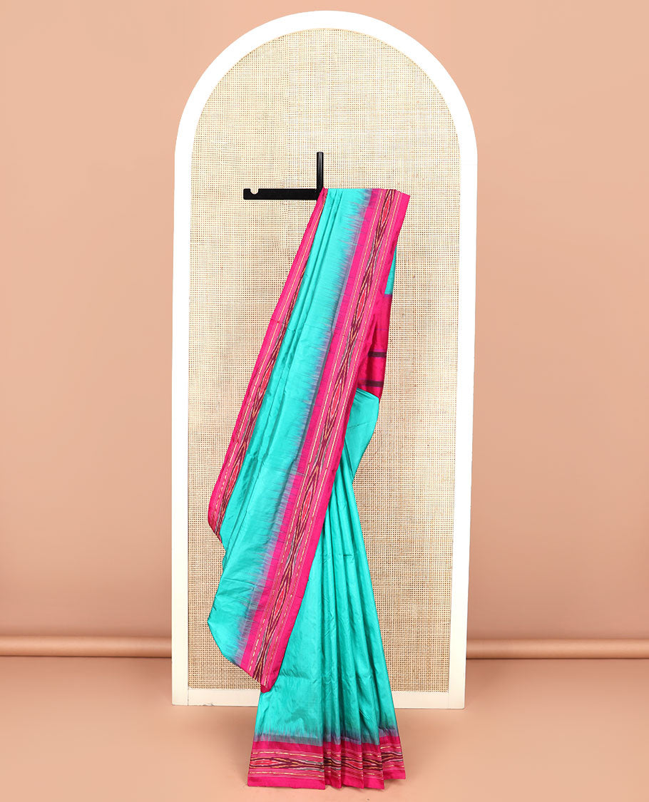 Turquoise Plain Ikkat Silk Saree with a Contrast Pink Border Completed by a Hazy Ikkat Weave, Featuring a Pallu with Stripes and Ikkat Texture
