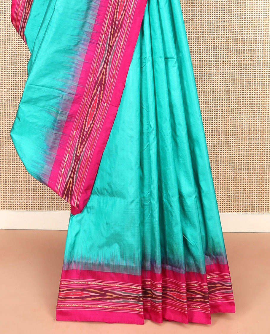 Turquoise Plain Ikkat Silk Saree with a Contrast Pink Border Completed by a Hazy Ikkat Weave, Featuring a Pallu with Stripes and Ikkat Texture