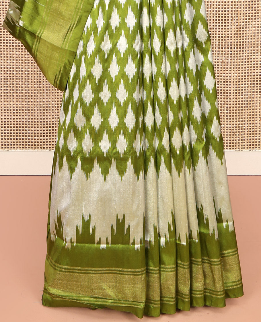 Green Pochampally Ikat Silk Saree, Elevated with Ikkat Buttas on Its Body, Complemented by a Ikkat-Style Woven Temple Border, Pallu of Ogee Patterns, and Paired with a Matching Blouse