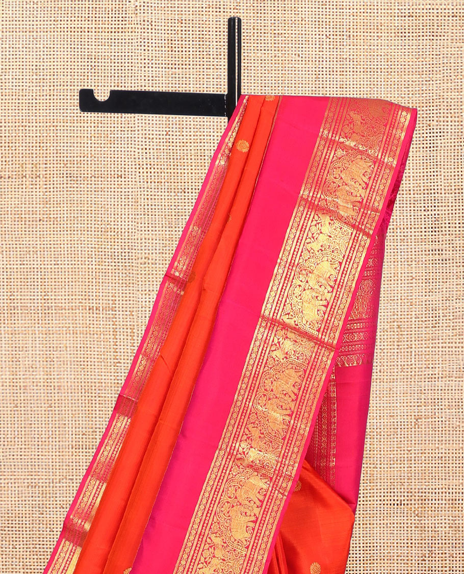 Orange Kanchipuram Silk Saree, Detailed with Zari Buttas, Complemented by Contrast Border of Banaras, Kamalam, and Yaanai Designs, Zari Woven Pallu, and Contrast Blouse