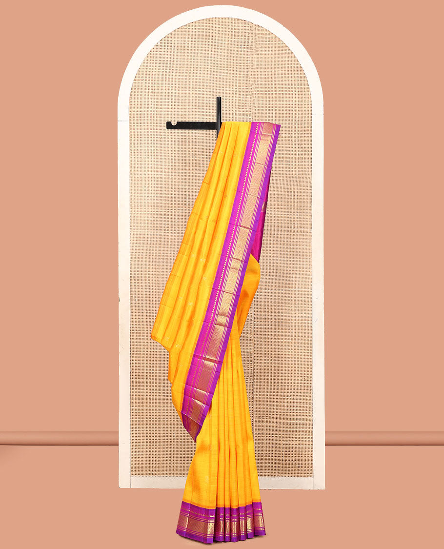 Yellow Kanchipuram Silk Saree, Delicately Woven with Zari Buttas, a Contrast One-Sided Korvai Border of Rekku, Banaras, and Jaal Designs, a Zari Design Pallu, and No Blouse