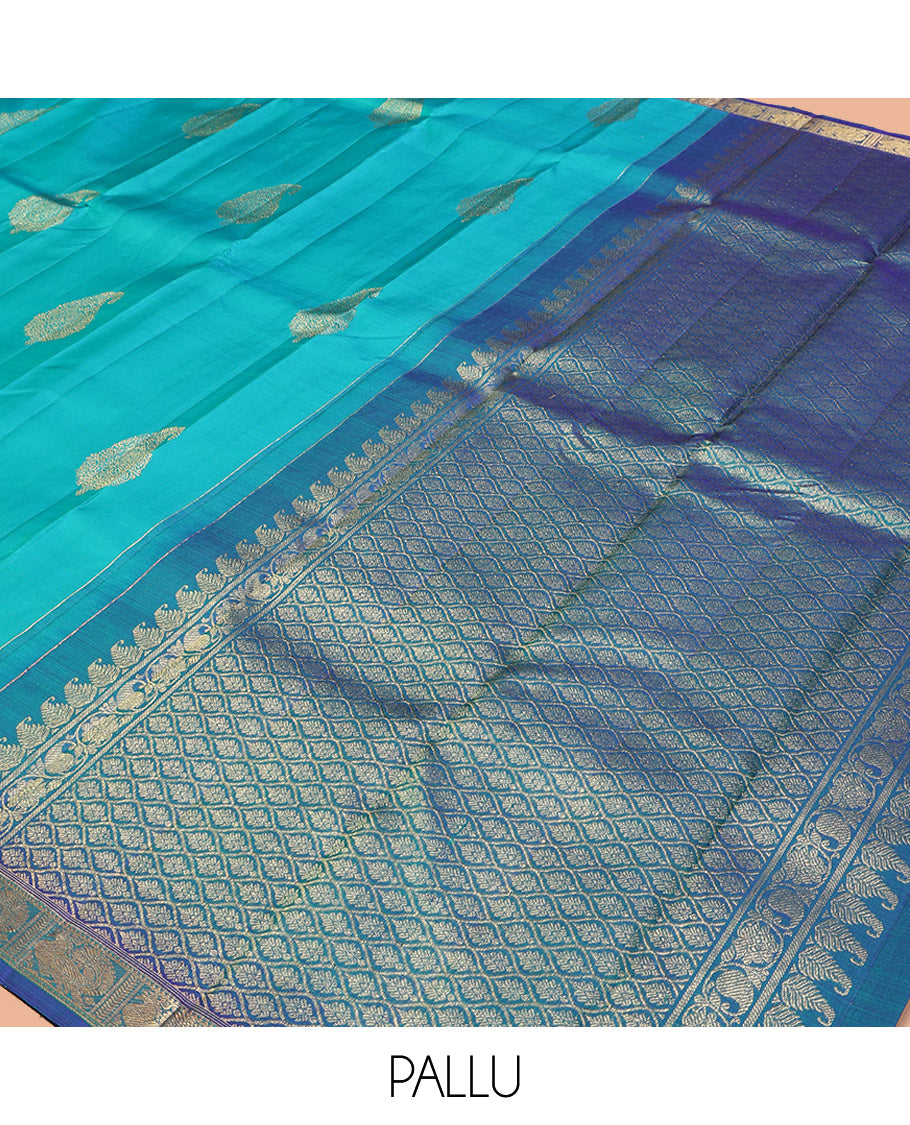 Blue Kanchipuram Silk Saree, Woven with Zari Buttas on Its Body, Complemented by Contrast Border of Annam Designs, Grand Jaal Design Pallu, and Paired with a Contrast Blouse
