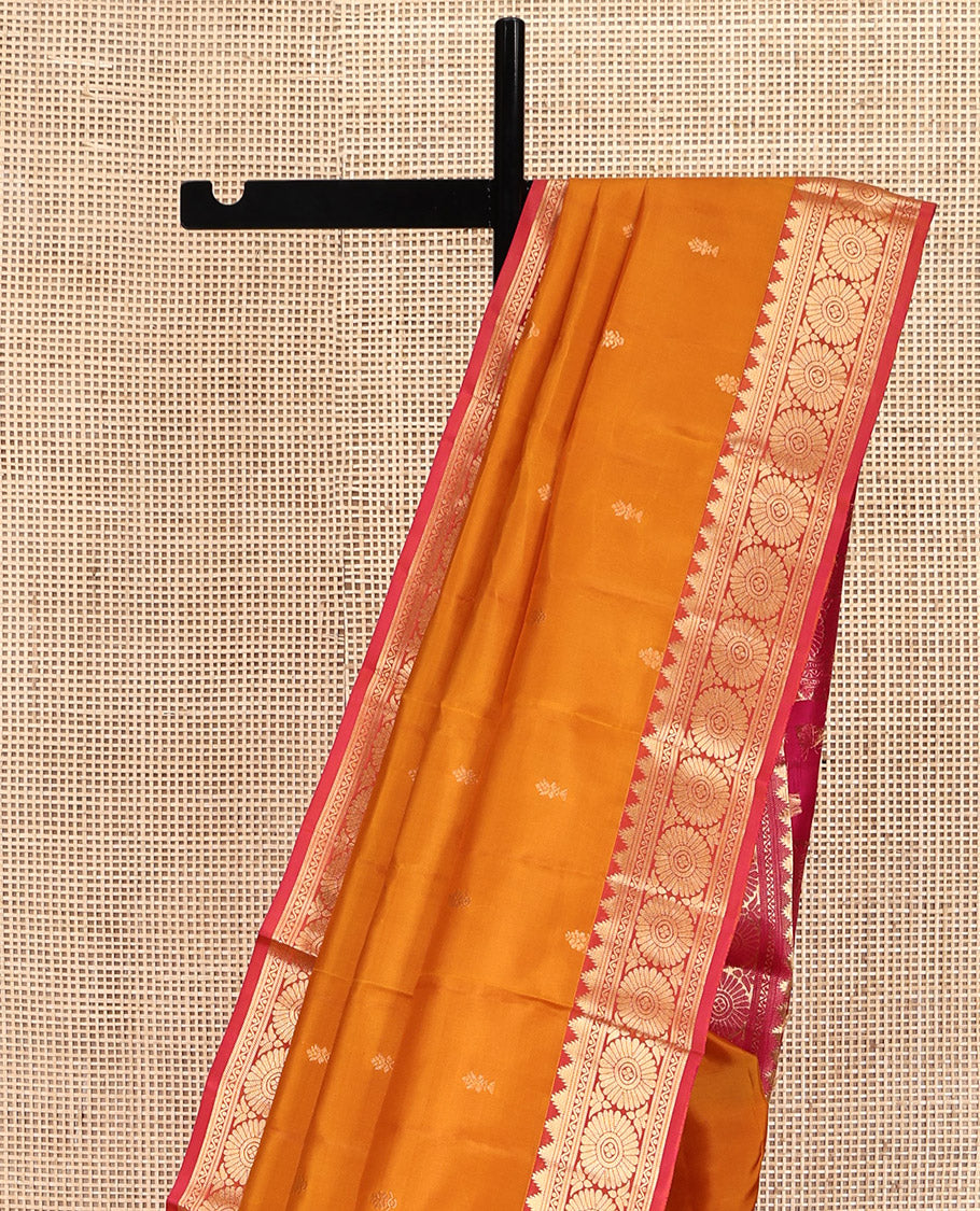 Orange Kanchipuram Silk Saree, Woven with Zari Buttas All Over Its Body, Complemented by a Contrast Border of Thazampoo Rekku, Banaras, Neli, and Chakram Designs, Intricately Designed Pallu, and Paired with a Contrast Blouse