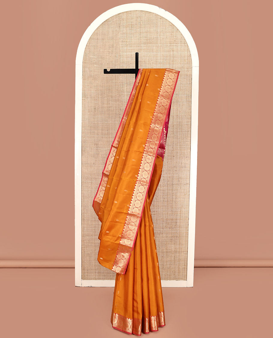 Orange Kanchipuram Silk Saree, Woven with Zari Buttas All Over Its Body, Complemented by a Contrast Border of Thazampoo Rekku, Banaras, Neli, and Chakram Designs, Intricately Designed Pallu, and Paired with a Contrast Blouse