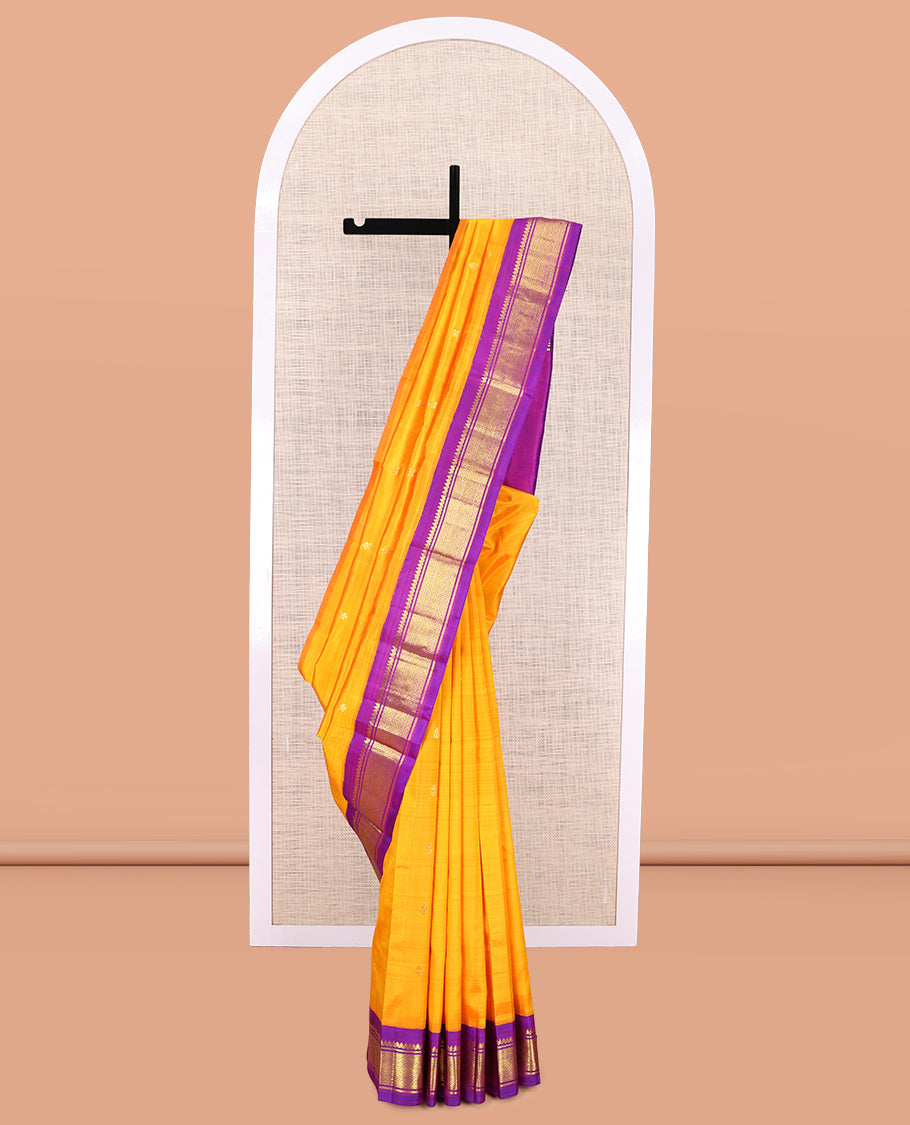 Yellow Kanchipuram Silk Saree, Gleamed Up with Zari Buttas, a Contrast Korvai Border of Thilakam Mokku, Banaras, and Jaal Designs, Zari Woven Pallu, and No Blouse