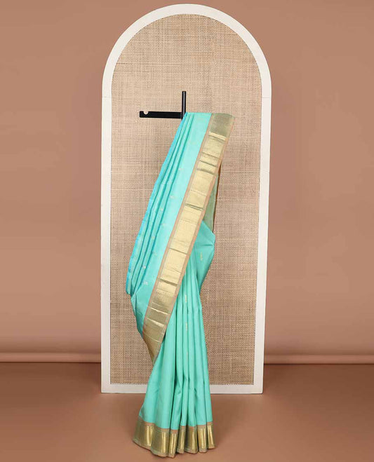 Light blue buttas kancheepuram silk saree with contrast border of rekku, kathir, kuyil kann design & zari design pallu