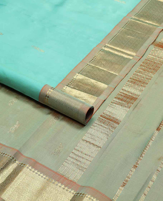 Light blue buttas kancheepuram silk saree with contrast border of rekku, kathir, kuyil kann design & zari design pallu