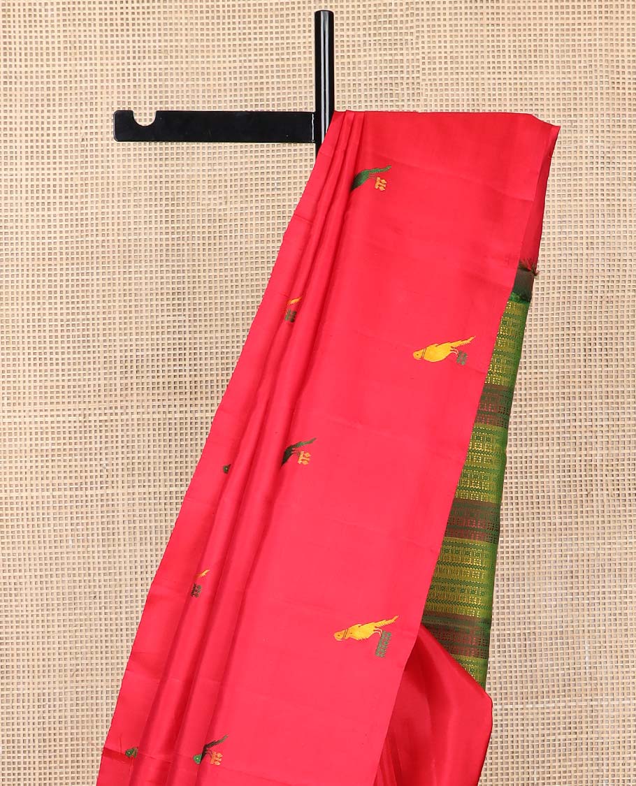 Borderless red parrot buttas kancheepuram silk saree with intricate floral design pallu