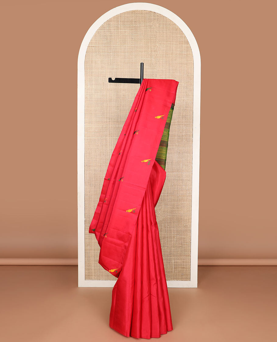 Borderless red parrot buttas kancheepuram silk saree with intricate floral design pallu
