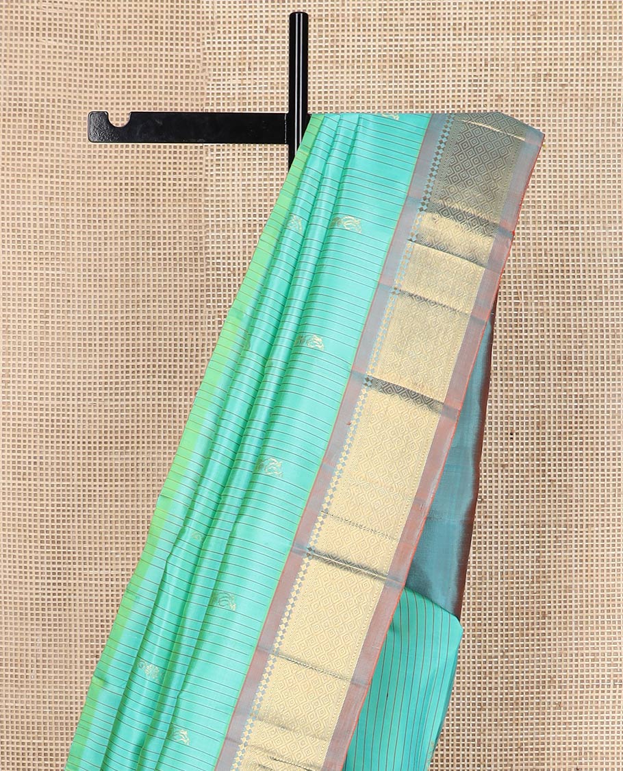 Blue stripes & buttas silk saree, contrast one-sided border of panner sombu, kathir & jaal & zari design pallu