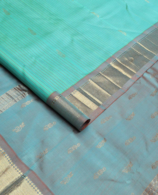 Blue stripes & buttas silk saree, contrast one-sided border of panner sombu, kathir & jaal & zari design pallu