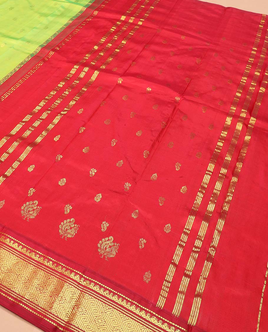 Green zari buttas Kanchipuram silk saree, contrast one-sided thazampoo rekku border of muthu, banaras, and jaal designs, and zari design pallu