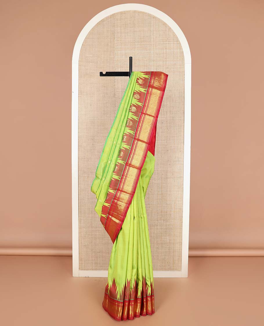 Green zari buttas Kanchipuram silk saree, contrast one-sided thazampoo rekku border of muthu, banaras, and jaal designs, and zari design pallu