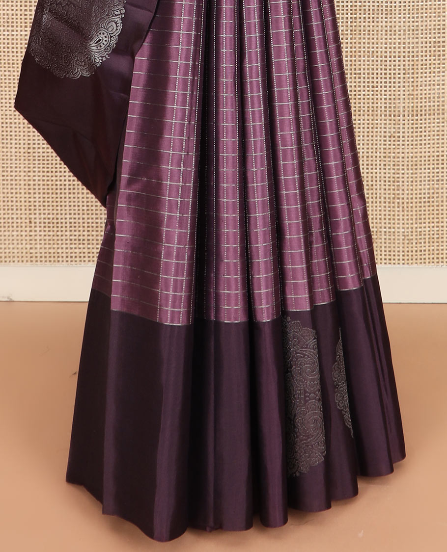 Purple checked Kanchipuram silk saree, contrast border of round-chakram style buttas, and paiyaadi kattam pallu