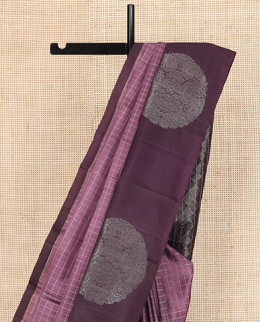 Purple checked Kanchipuram silk saree, contrast border of round-chakram style buttas, and paiyaadi kattam pallu