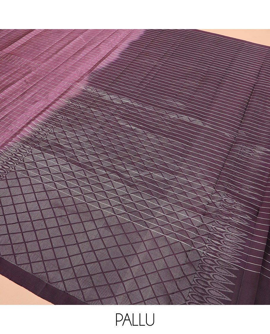 Purple checked Kanchipuram silk saree, contrast border of round-chakram style buttas, and paiyaadi kattam pallu
