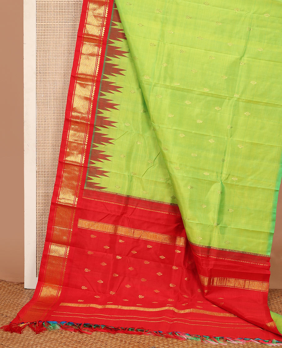 Parrot green zari buttas Kanchipuram silk saree, contrast one-sided thazampoo rekku traditional zari border, and zari design pallu