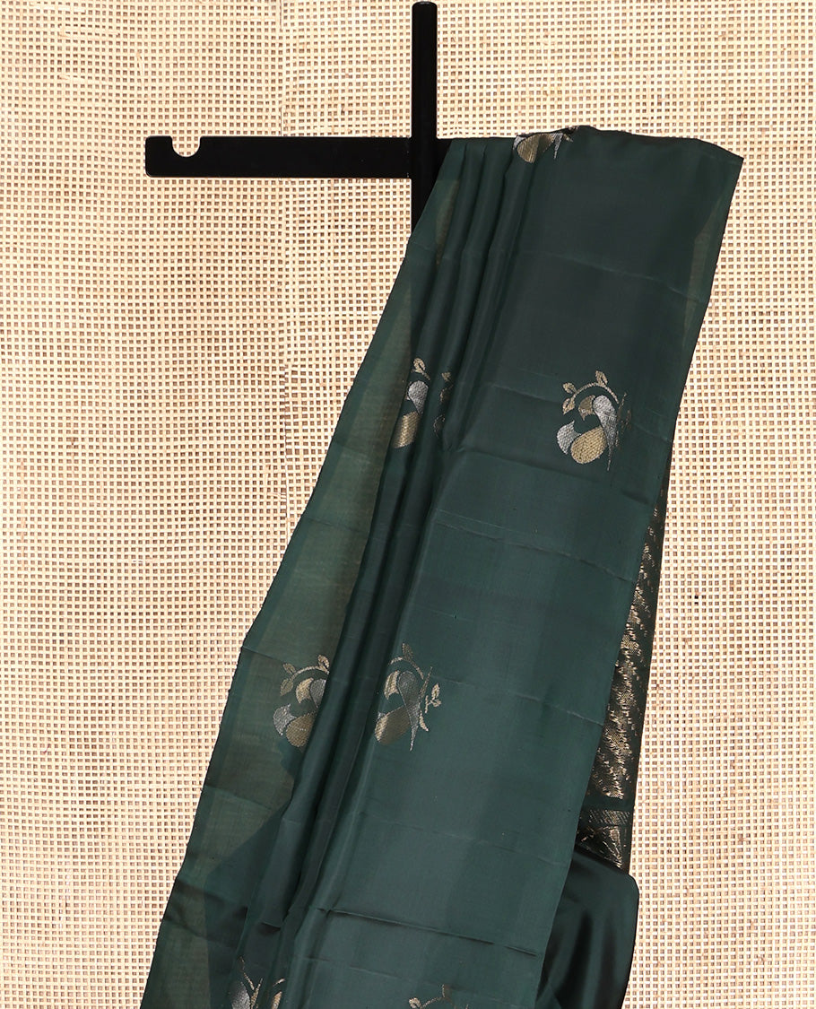 Borderless Green Mayuri Lite Silk Mix Saree, Detailed with Bird Buttas All Over Its Body, Highlighted by a Zari Pallu of Diagonal Stripes and Chakram Designs, and Paired with a Matching Blouse