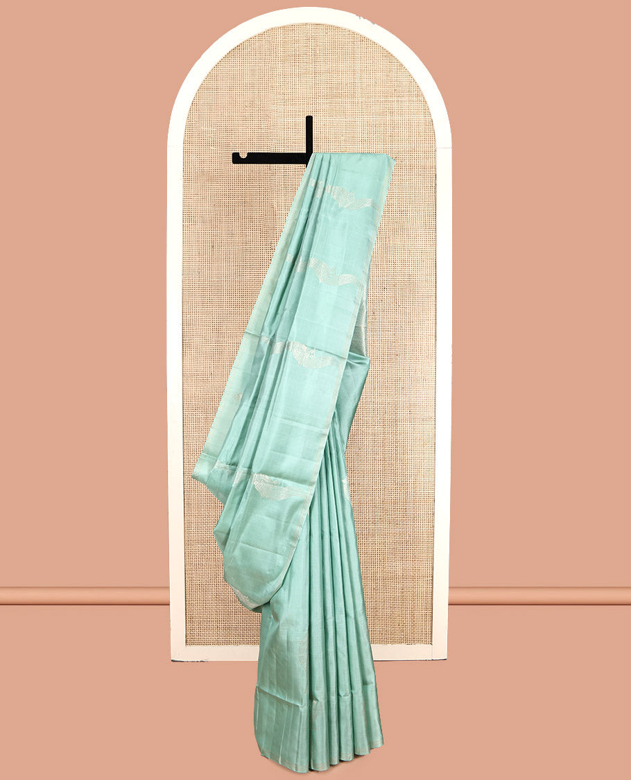 Pale Green Mayuri Soft Silk Saree, Beautifully Bedecked with Kili Buttas, a Subtle Piping Border, Sparsely Woven Pallu, and a Matching Blouse