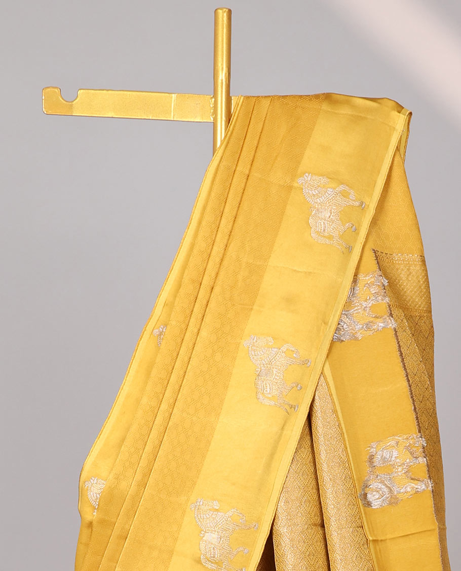 Yellow mushru silk saree with contrast horse motifs border & intricate zari design pallu