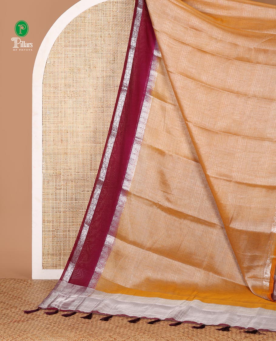 Peach plain design Tissue silk saree, contrast traditional zari border of bentex design & lined pallu with tassels