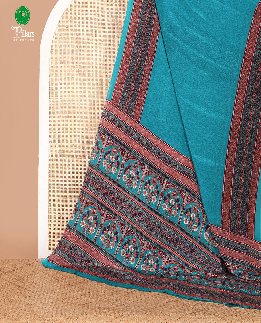 Blue negative-style sparsely printed crepe silk saree, contrast printed border, printed pallu & printed blouse